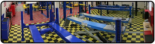 This is a picture of our 2 post car lift area of our showroom. Shown in this picture are two post base plate lifts, two post overhead or clear floor lifts, mid rise or scissor lifts, and the lawn mower adapters that make a lawn mower lift. 