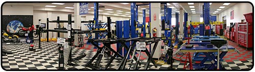 Pictures of wheel dollies, floor tile, floor jacks, jack stands, tool cabinets, winches, heavy duty wheel dollies, motorcycle stand, and shop presses in our showroom.